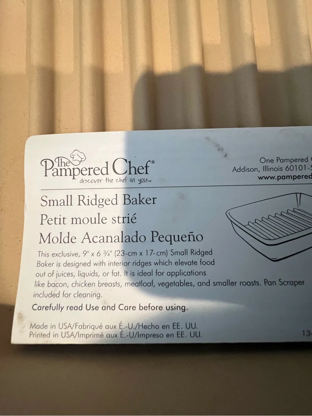 Pampered Chef Small Ridged Baker in tan-beige—never used.  New without box.